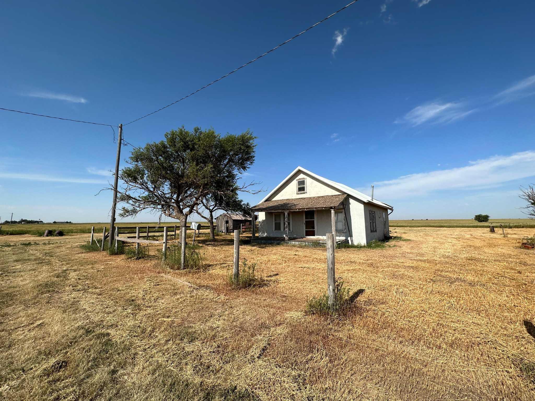 2015 County Road 9 Tulia, TX 79088 - Photo 30 of 33 a view of a house with a yard