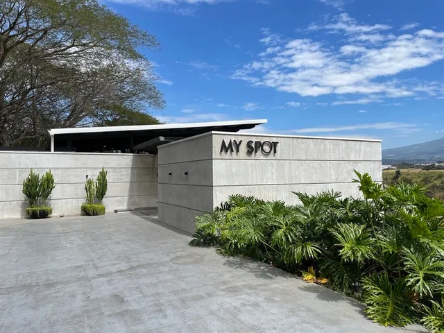 a view of a patio with a table and chairs