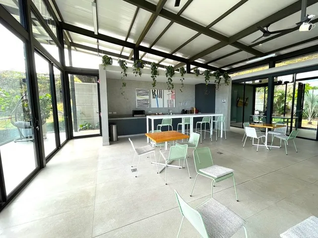 a view of a room with wooden floor and a window