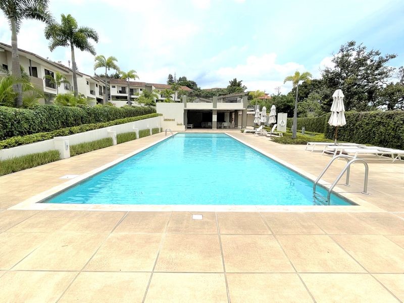 44 Condominio Bosques Del Cafe Mountains, Unit 44 Almont, CO 81210 - Photo 19 of 19 a view of a swimming pool with a lounge chairs