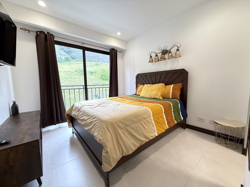 44 Condominio Bosques Del Cafe Mountains, Unit 44 Almont, CO 81210 - Photo 3 of 19 a bedroom with a bed and a window