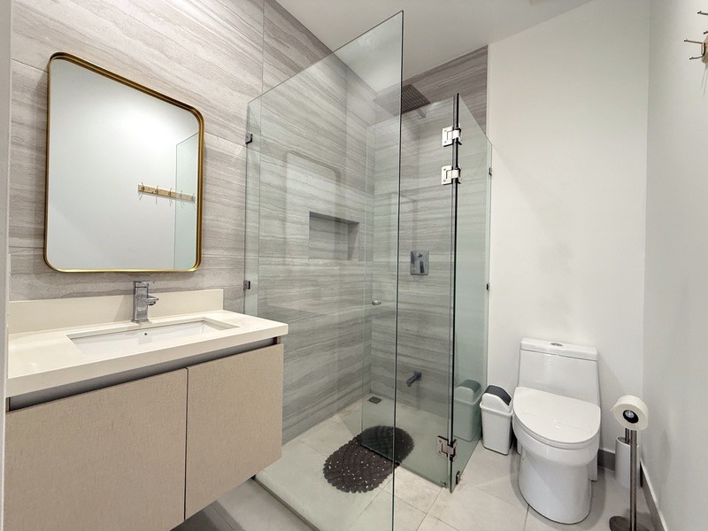 44 Condominio Bosques Del Cafe Mountains, Unit 44 Almont, CO 81210 - Photo 4 of 19 a bathroom with a toilet sink vanity granite and shower