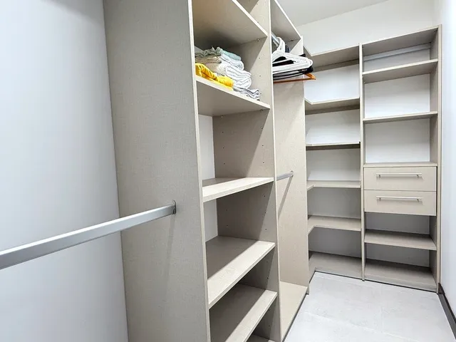 a view of swimming pool with a lounge chair