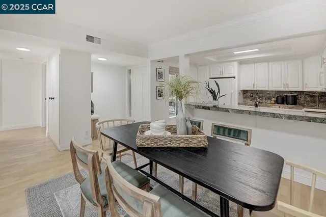 a bedroom with a bed and mirror