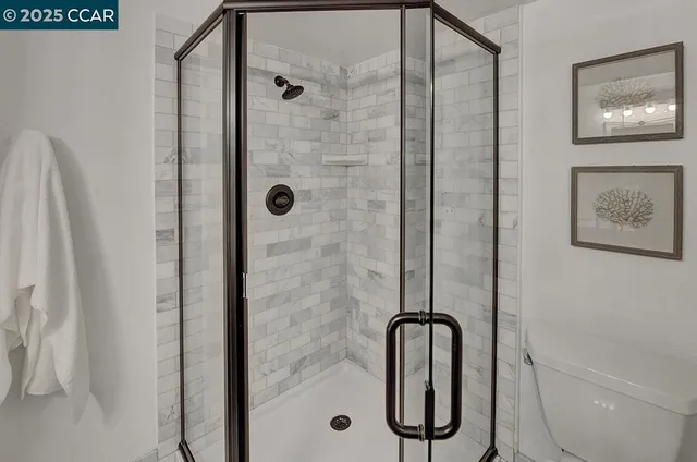 a bathroom with a toilet and a bathtub