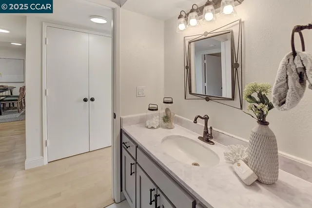 a spacious bathroom with a double vanity sink and a mirror