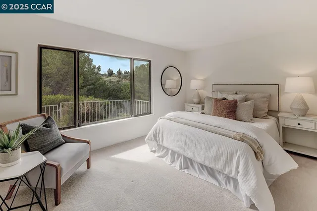 a bathroom with a granite countertop sink a mirror and cabinets