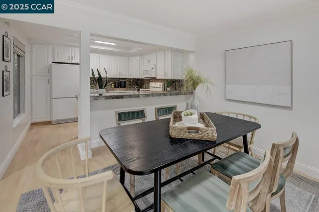 a kitchen with a white stove top oven and white cabinets