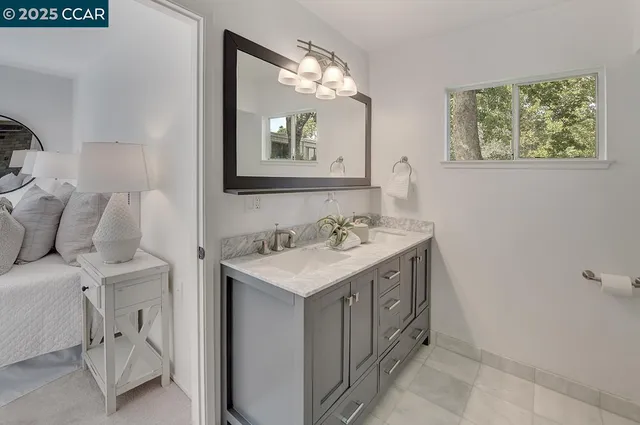 a view of a chairs and table in backyard of the house