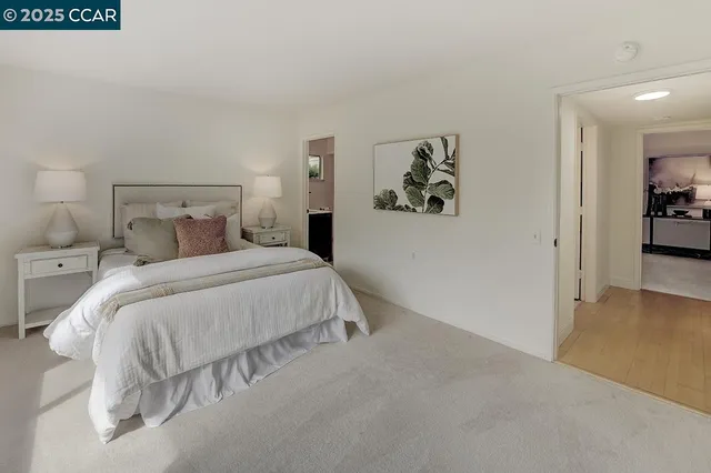 a view of patio with table and chairs and potted plants
