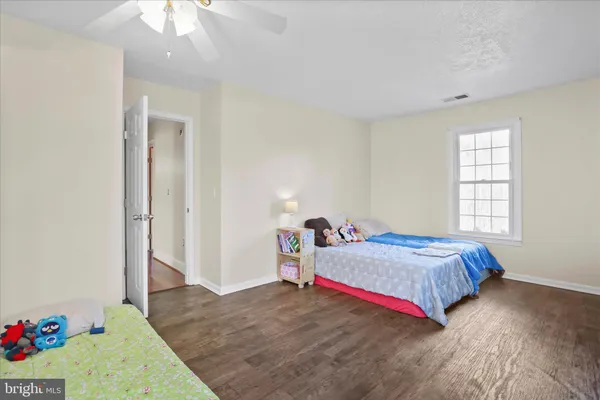 a bathroom with a sink mirror and toilet