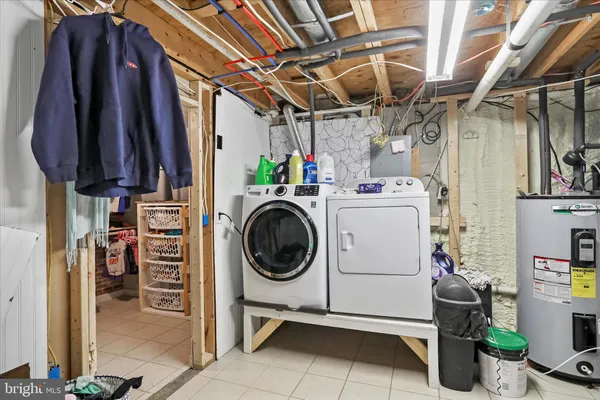 a view of a dining room with furniture and a potted plant