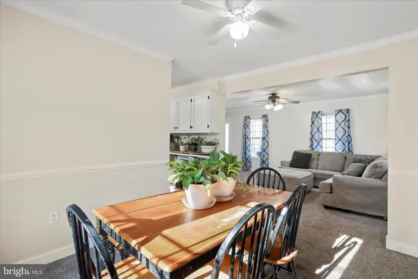 a living room with furniture and white walls