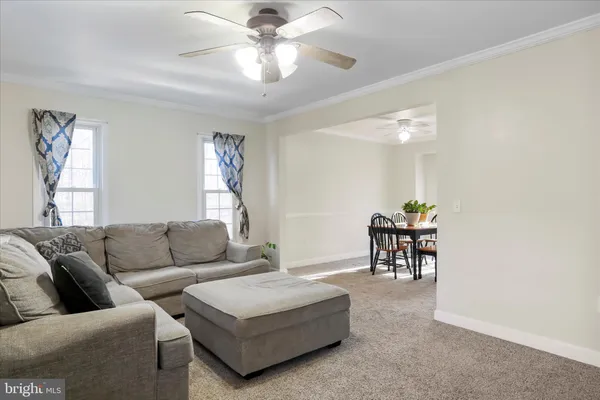 a kitchen with stainless steel appliances granite countertop white cabinets and window
