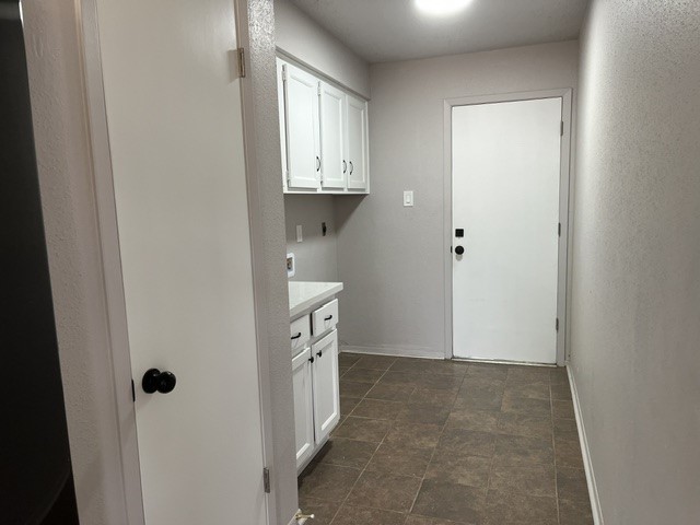 467 Buoy Road Webster, TX 77598 - Photo 22 of 23 Inside utility area with lots of cabinets for storage.
