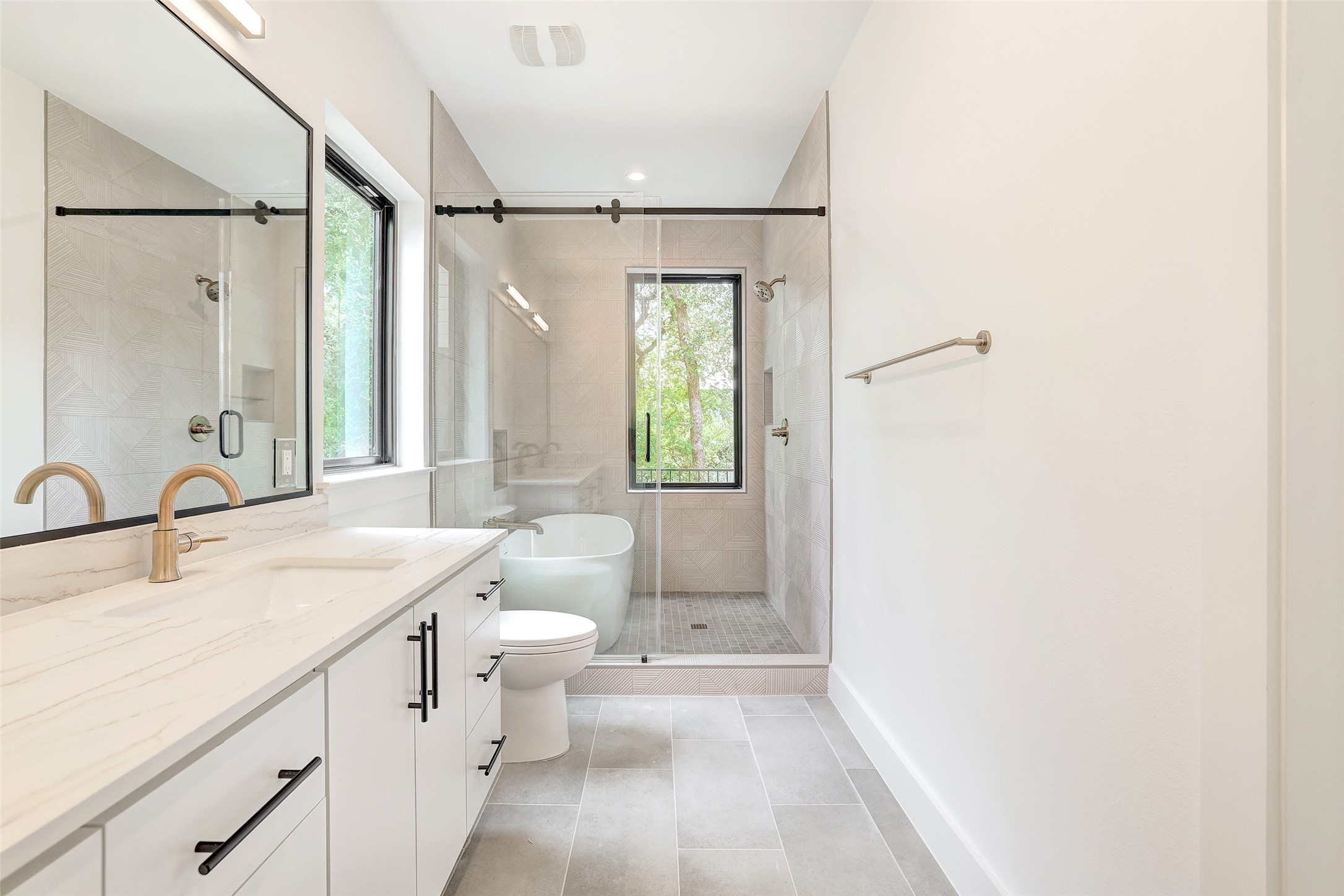 3208 Clawson Road, Unit 5A Austin, TX 78704 - Photo 25 of 34 Bathroom with vanity, a shower stall, and tile patterned floors