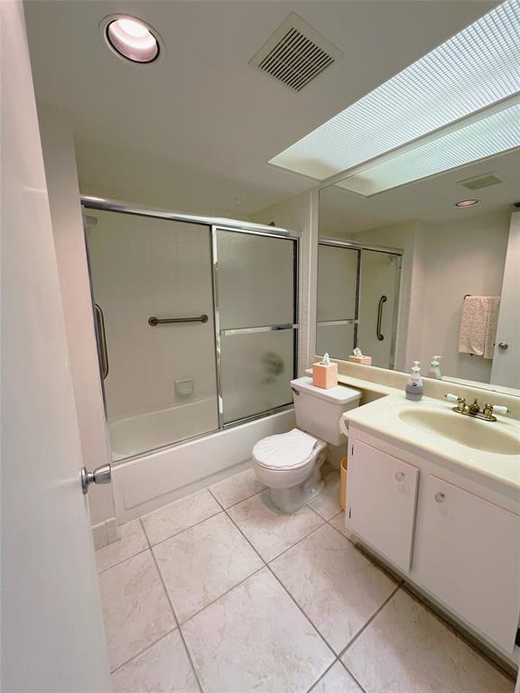 1803 Eleuthera Point, Unit J2 Coconut Creek, FL 33066 - Photo 13 of 27 a bathroom with a double vanity sink toilet and shower