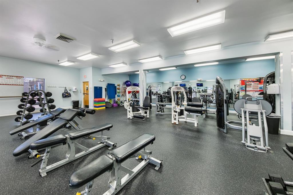 1803 Eleuthera Point, Unit J2 Coconut Creek, FL 33066 - Photo 22 of 27 a view of a room with gym equipment