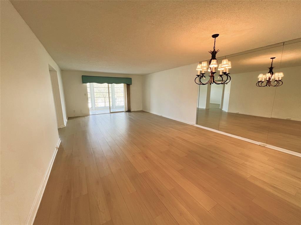 1803 Eleuthera Point, Unit J2 Coconut Creek, FL 33066 - Photo 4 of 27 a view of livingroom and kitchen with window