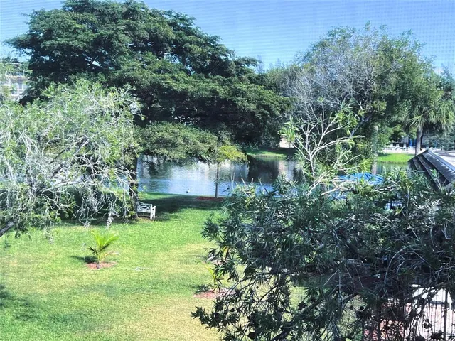 a view of a garden with a fountain