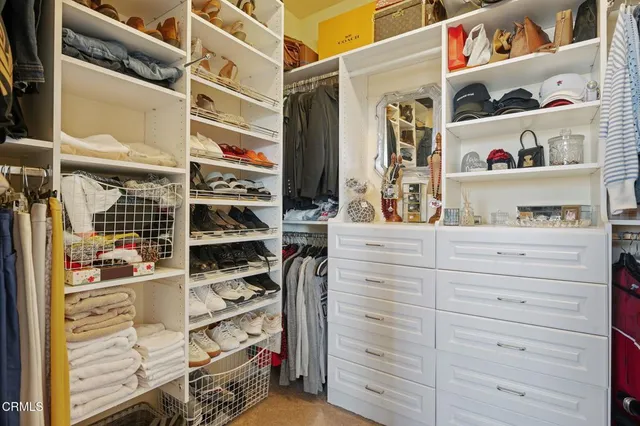 a bedroom with furniture and a book shelf
