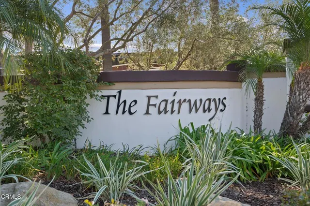 a view of a backyard with sitting area