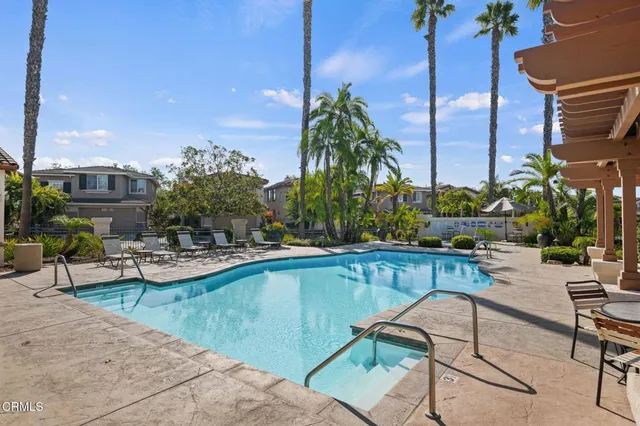 a view of a swimming pool with a lounge chair