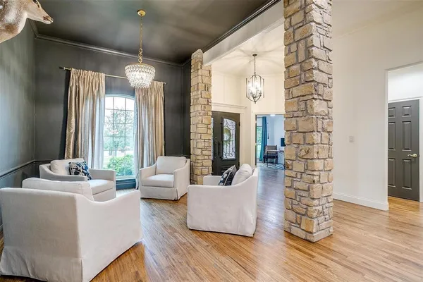 a living room with furniture fireplace and flat screen tv