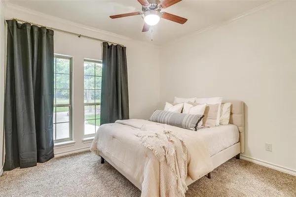 a bedroom with a bed and window