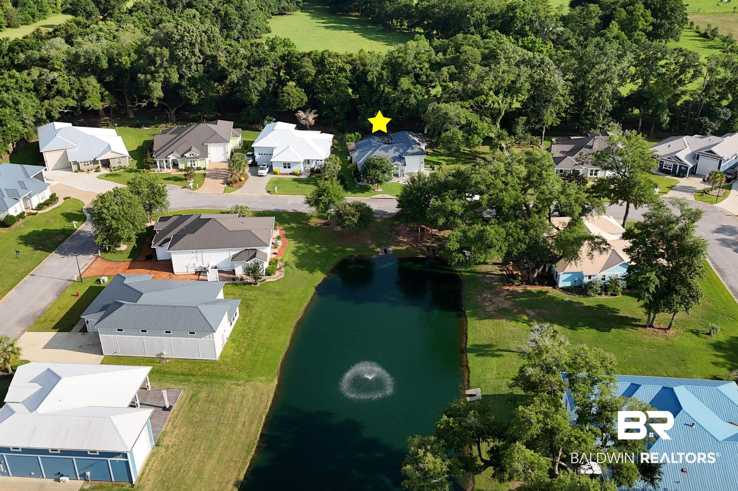 12254 Reunion Place Foley, AL 36535 - Photo 10 of 62 Aerial perspective of suburban area with a large body of water
