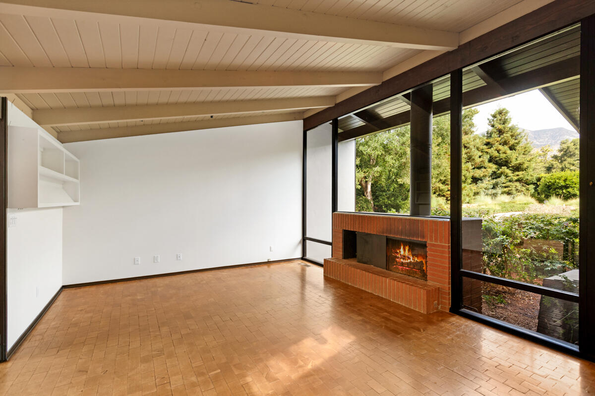 1681 East Valley Road Montecito, CA 93108 - Photo 16 of 61 a view of an empty room with a window and fire place