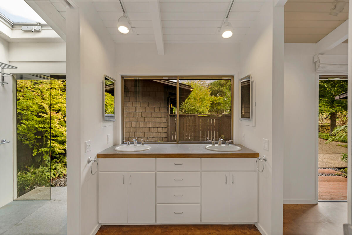 1681 East Valley Road Montecito, CA 93108 - Photo 22 of 61 a bathroom with a sink and a mirror