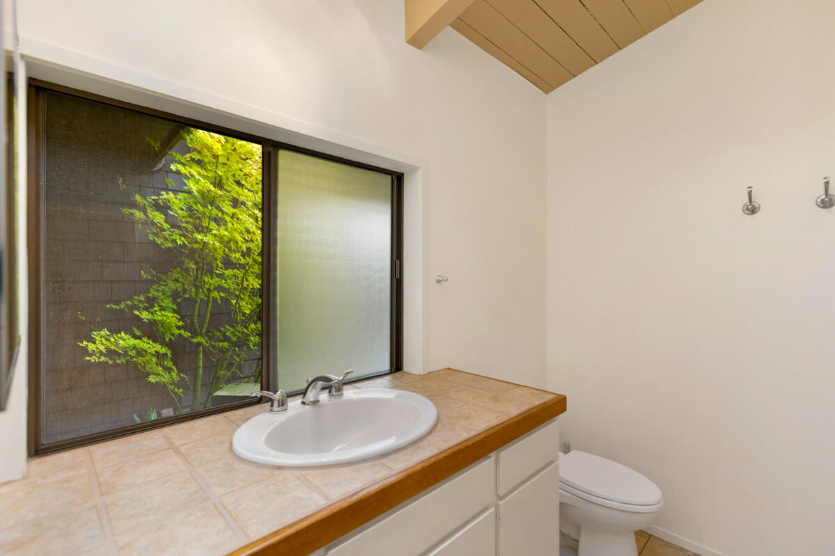 1681 East Valley Road Montecito, CA 93108 - Photo 27 of 61 a bathroom with a sink and a mirror