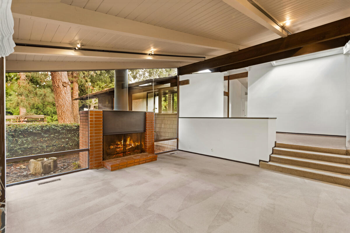 1681 East Valley Road Montecito, CA 93108 - Photo 28 of 61 a view of an empty room with a fireplace and a window