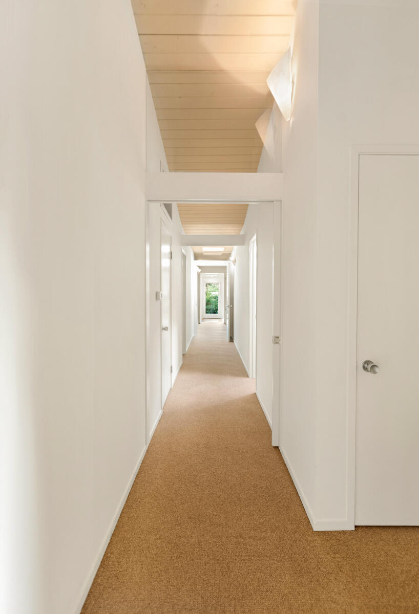 1681 East Valley Road Montecito, CA 93108 - Photo 31 of 61 a view of a hallway with wooden shelves