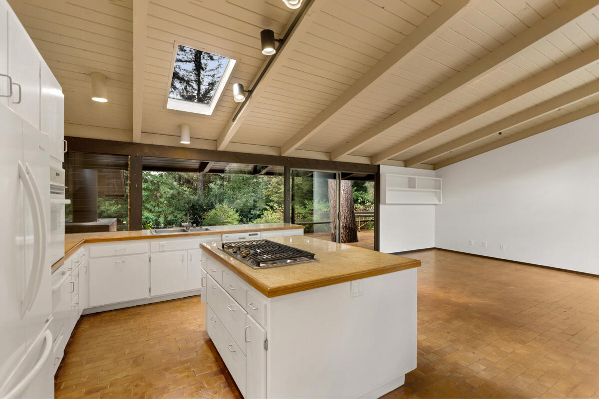 1681 East Valley Road Montecito, CA 93108 - Photo 33 of 61 a kitchen that has a stove a sink and a microwave