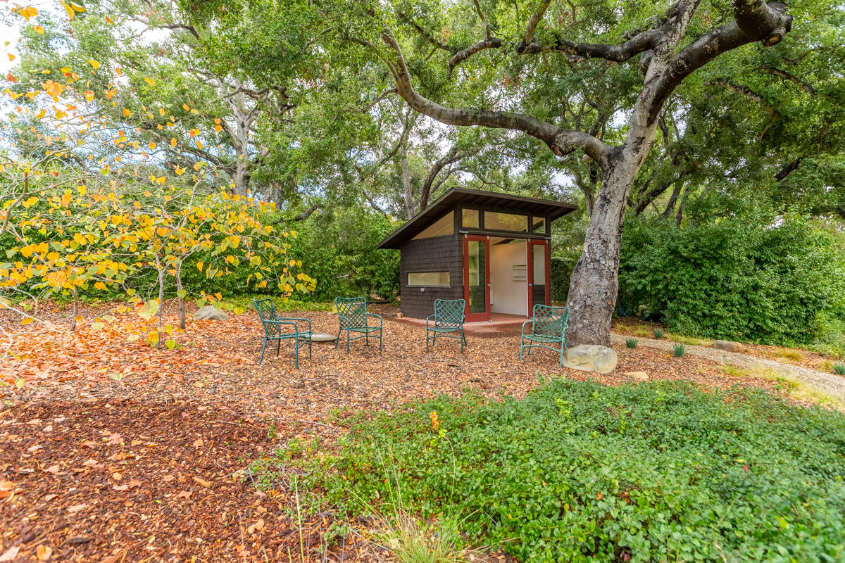 1681 East Valley Road Montecito, CA 93108 - Photo 46 of 61 a view of a chair and table in the garden
