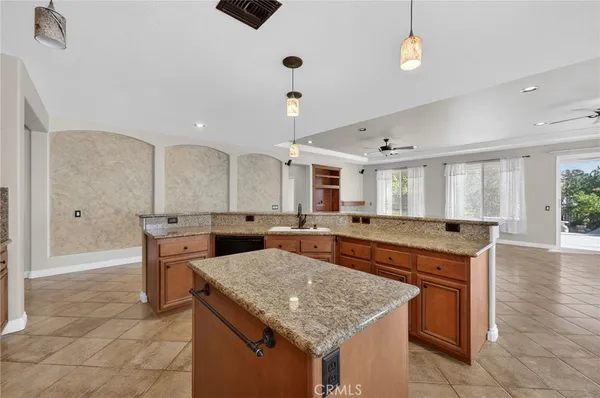 a kitchen with a stove and a refrigerator