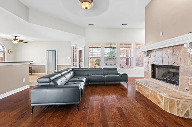 a living room with furniture and a fireplace