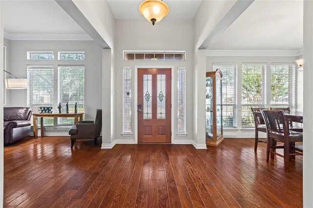 a view of livingroom with furniture wooden floor and windows