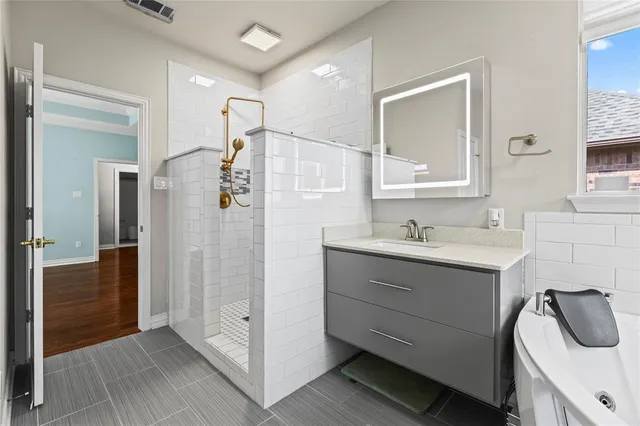 a bathroom with a sink and mirror