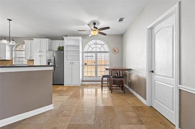 a view of a kitchen with furniture and a window