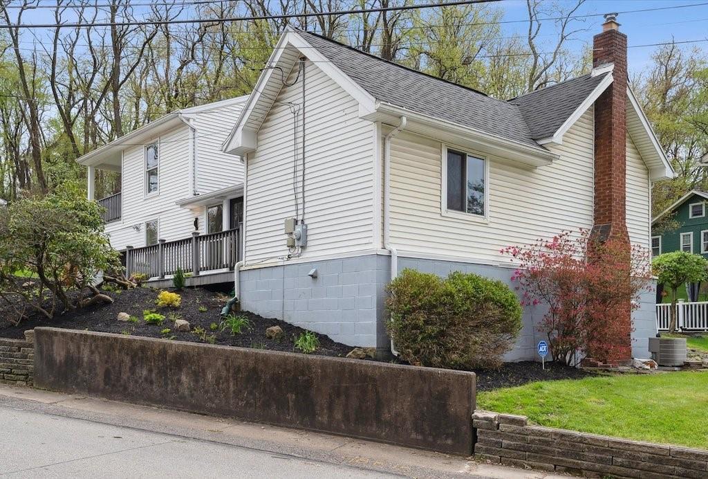 642 Filmore Road Pittsburgh, PA 15221 - Photo 2 of 30 a view of a white house with a yard and potted plants