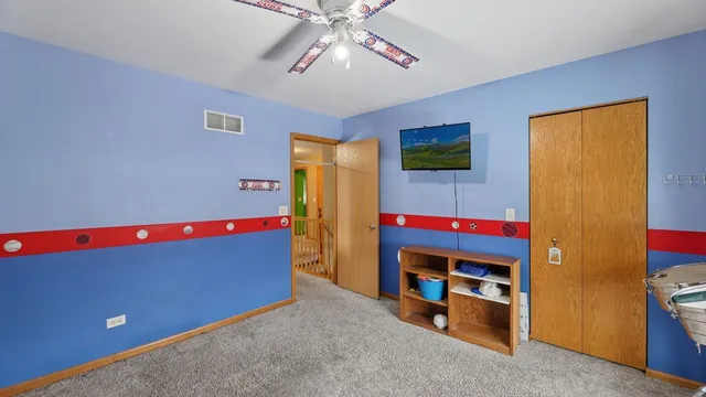 a room with furniture and flat screen tv