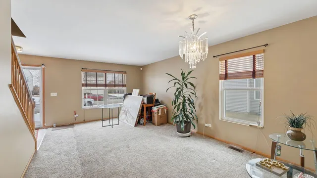 a view of livingroom with hardwood floor and a ceiling fan