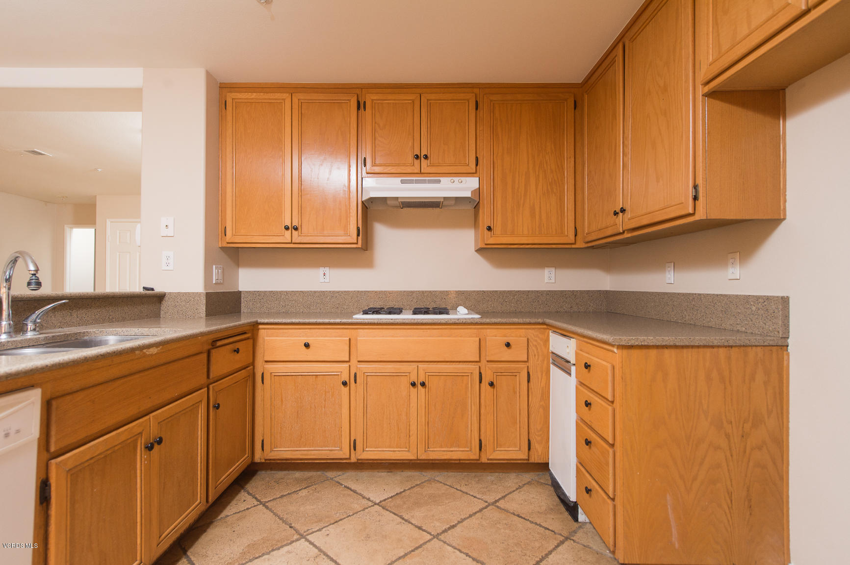 711 Perth Place Oxnard, CA 93035 - Photo 8 of 16 a kitchen with granite countertop cabinets stainless steel appliances and a sink