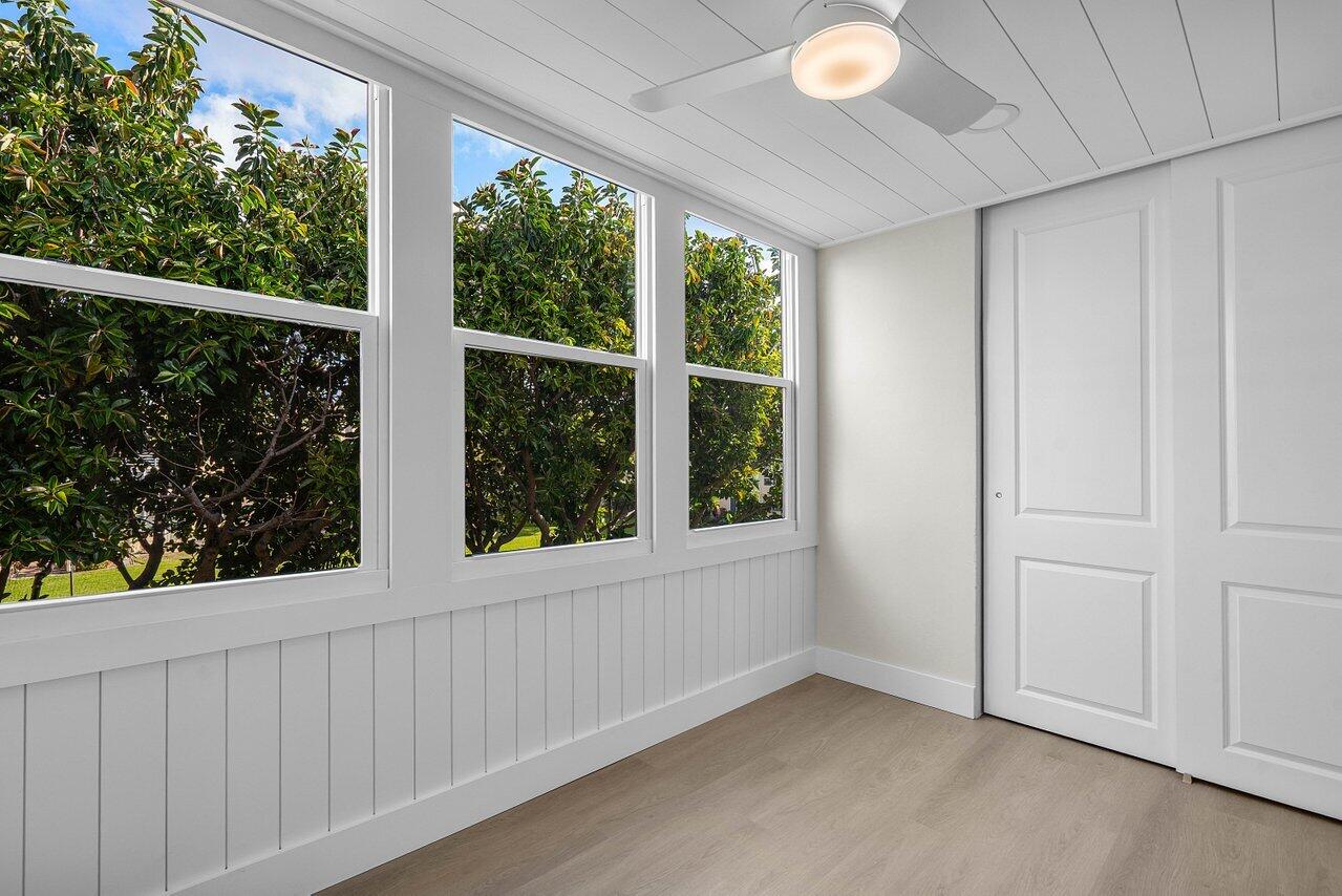 2601 Northeast 3rd Street, Unit 3040 Boynton Beach, FL 33435 - Photo 13 of 24 a view of an empty room with a window and hardwood floor