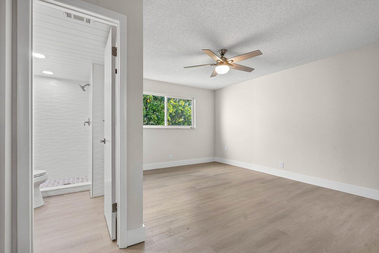 2601 Northeast 3rd Street, Unit 3040 Boynton Beach, FL 33435 - Photo 18 of 24 an empty room with a ceiling fan and a window