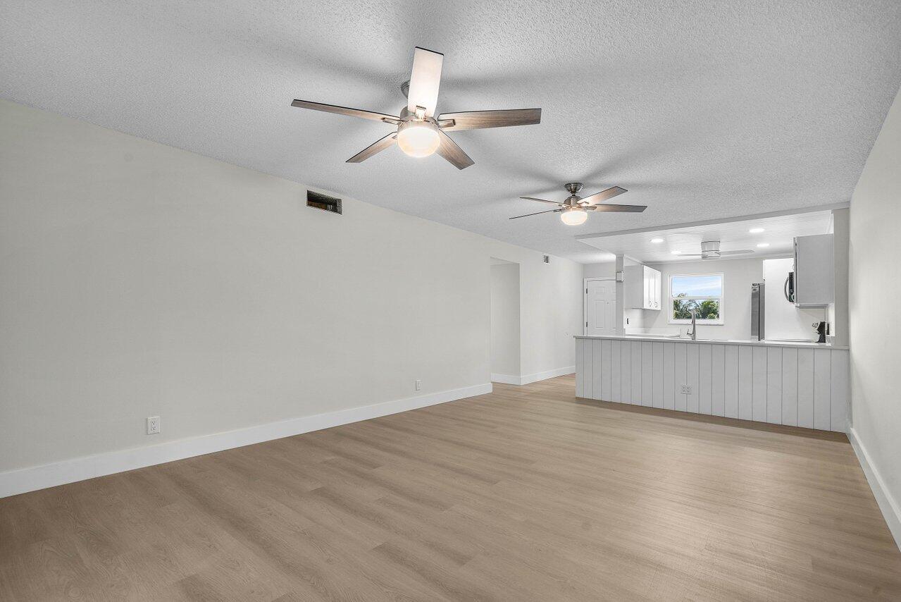 2601 Northeast 3rd Street, Unit 3040 Boynton Beach, FL 33435 - Photo 10 of 24 wooden floor in an empty room