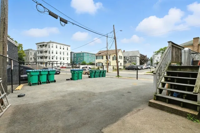 a view of a city street with a bench